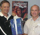 Peter Verwer, Comtest MD, presenting Gideon Knoetze of ManDirk with 'Best Overall Performance' dealer award